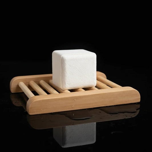 Shower steamer sitting on top of bamboo tray