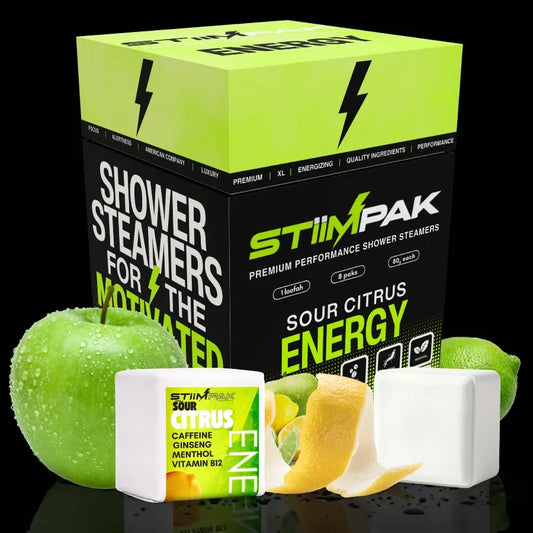 Box of StiimPak shower steamers with green apple and white cubes on a black background