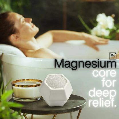 Woman relaxing in a bathtub with a candle and a geobath bath bomb, with text about magnesium.
