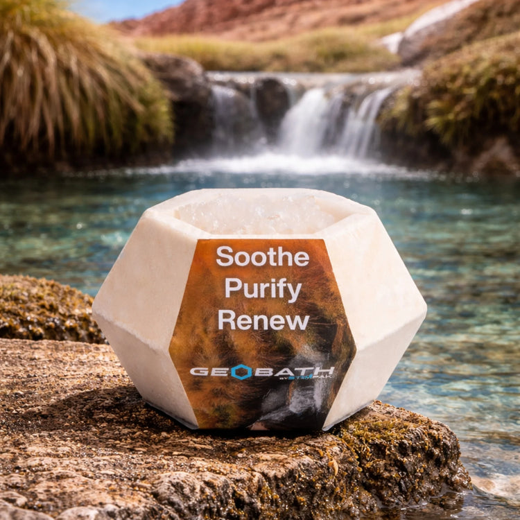 Geobath Geode Bath Bomb with 'Soothe Purify Renew' text in a natural setting with water and rocks.