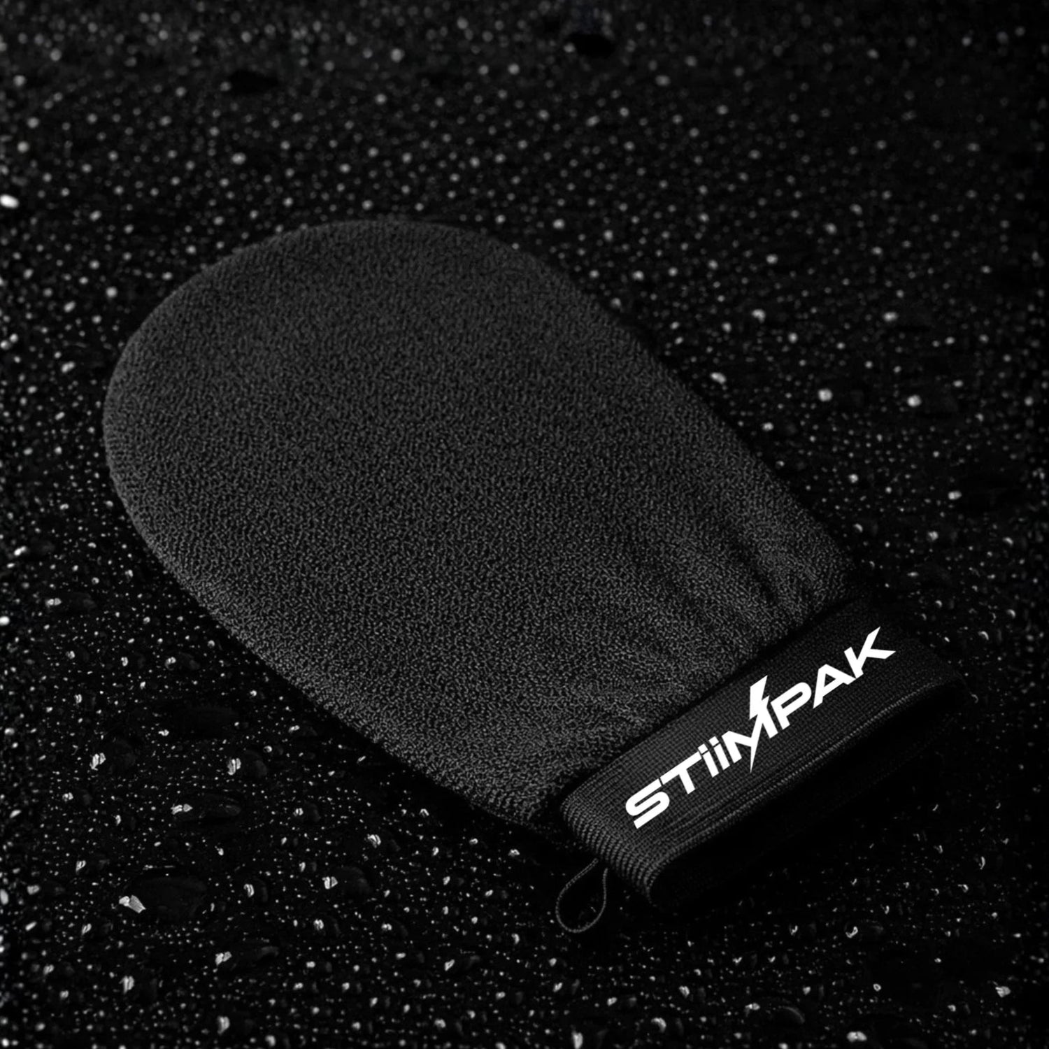 Black mitt with Stimpak branding on a black textured background