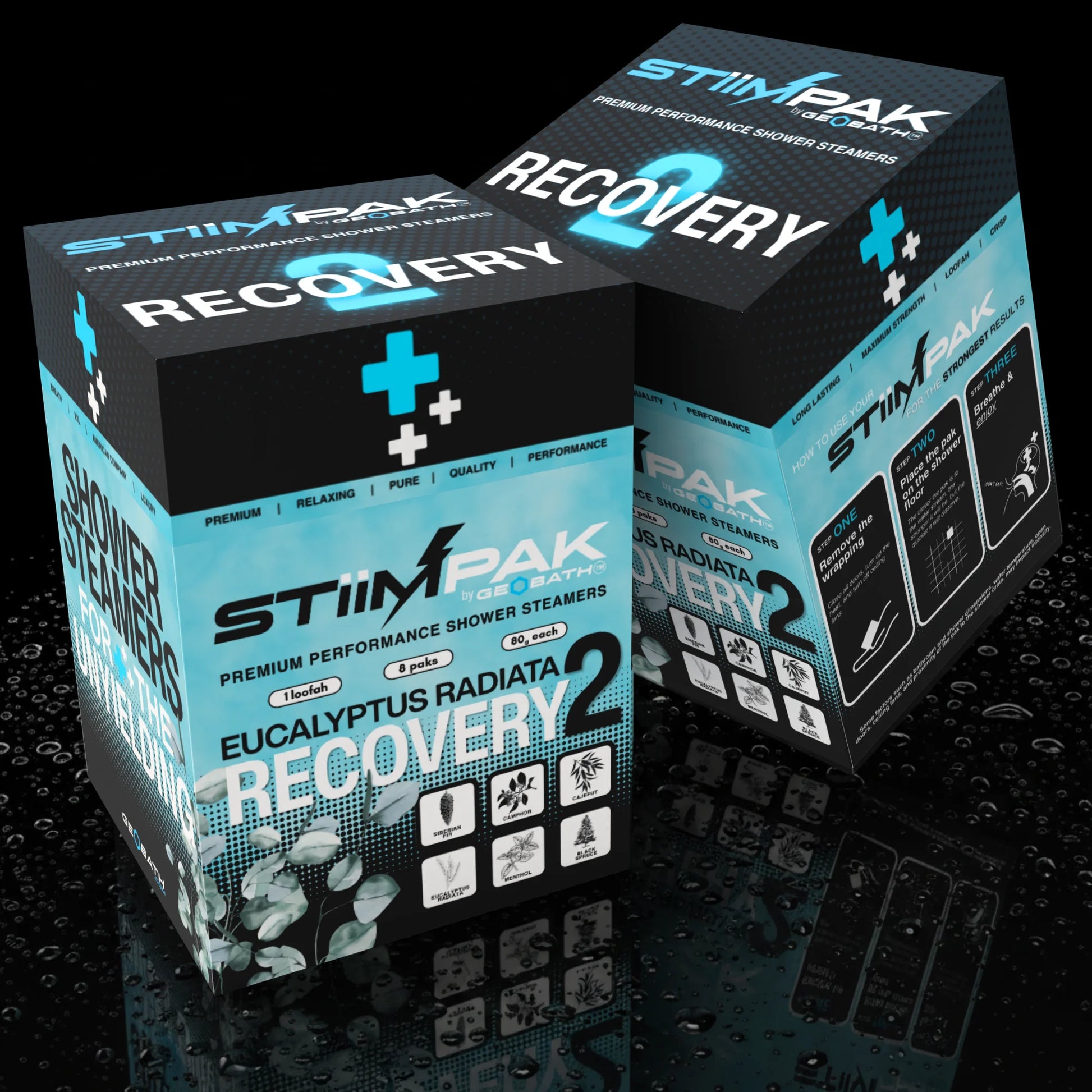 Two STiiMPaK Shower Steamers Recovery 2 boxes shown on a glossy black reflective surface with water droplets. The packaging is black and bright cyan/light blue