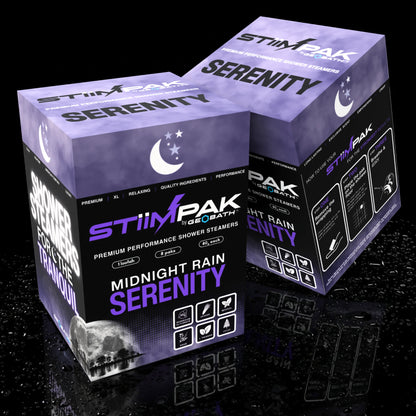 Serenity Midnight Rain Shower steamer boxes showing front and back views on a dark reflective background. The boxes are predominantly purple and black with white and purple text, and the front box reads 'Midnight Rain Serenity.
