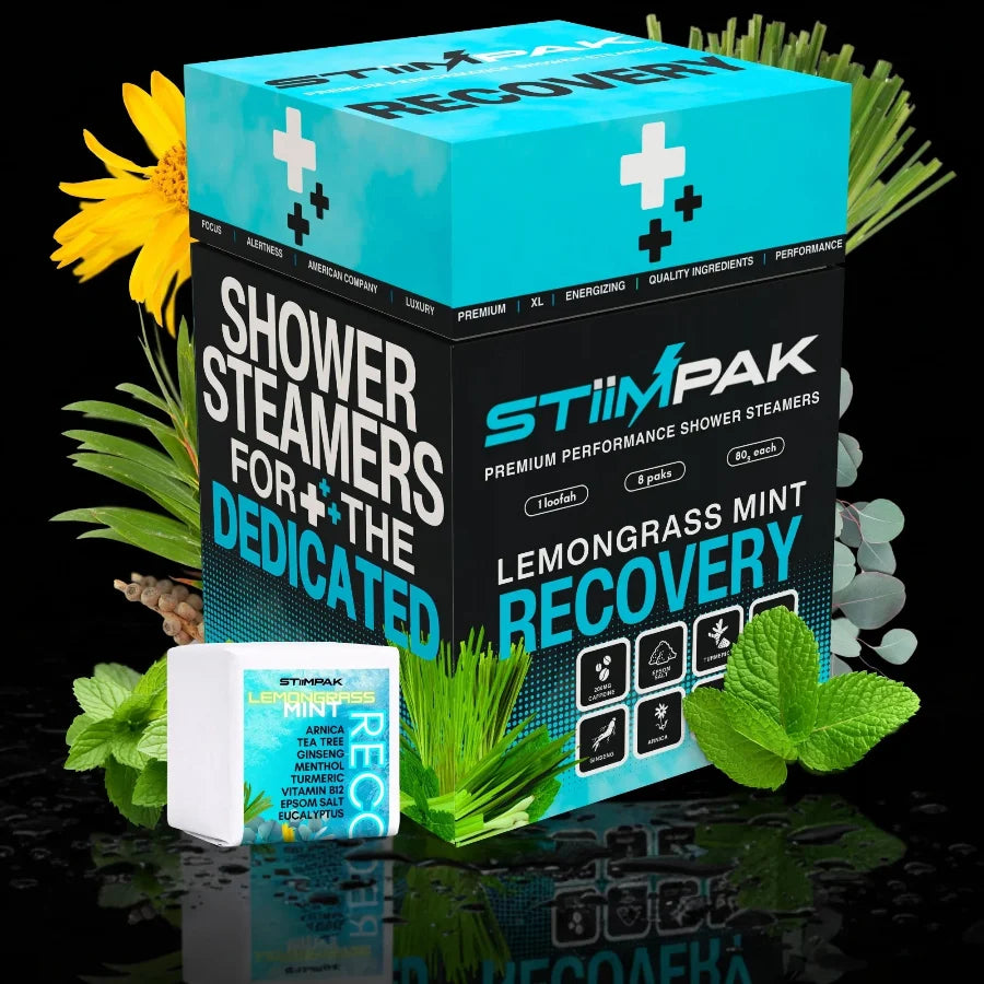 STIIMPAK Lemongrass Mint Recovery shower steamers packaging with greenery on a reflective surface.