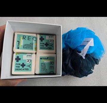 Box of Recovery STiiMPAK Shower Steamers and loofah
