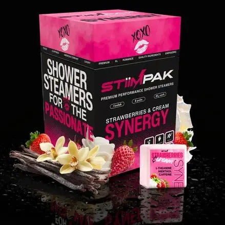 StimPak Strawberry & Cream Synergy shower steamers with packaging and ingredients on a black background