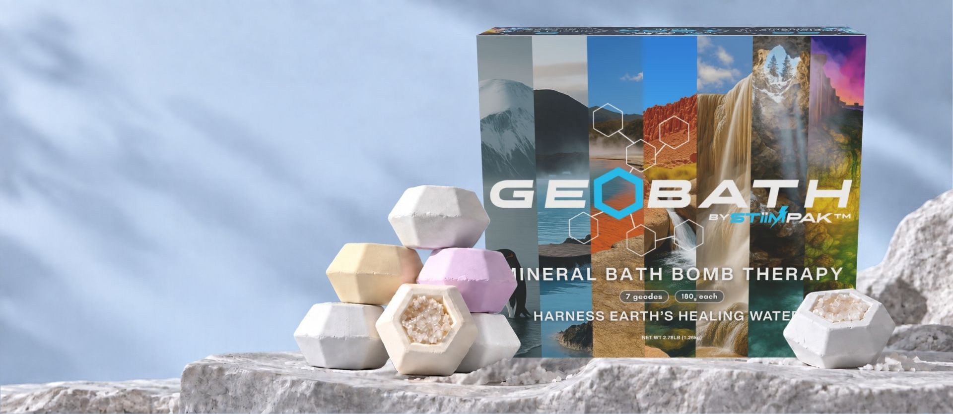 Geobath mineral bath bomb box with faceted geodes and visible crystal centers on pale stone.